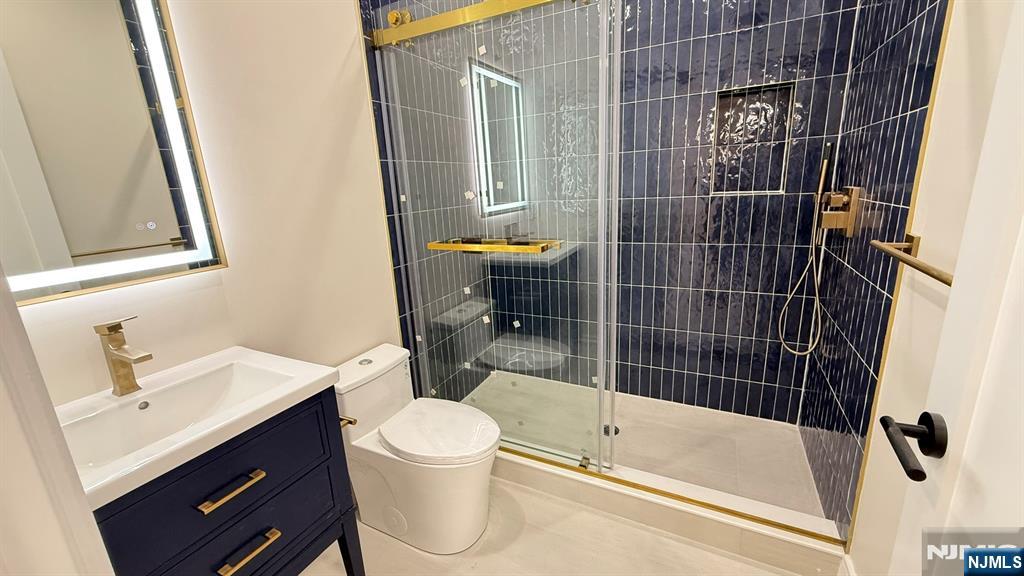 24 Peterson Road Wayne, NJ 07470 - Photo 18 of 31 a bathroom with a sink toilet and shower