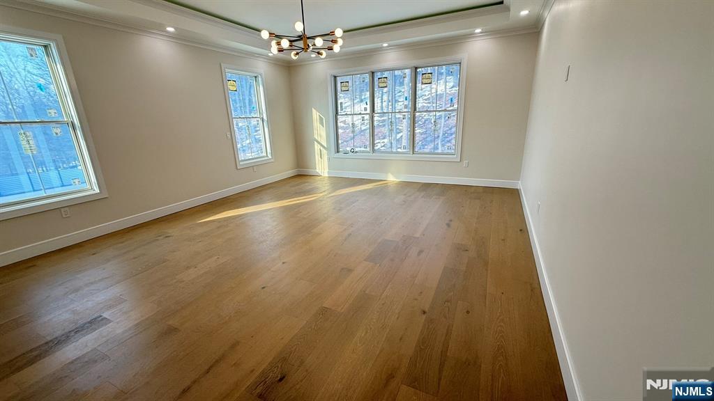 24 Peterson Road Wayne, NJ 07470 - Photo 19 of 31 an empty room with wooden floor and windows