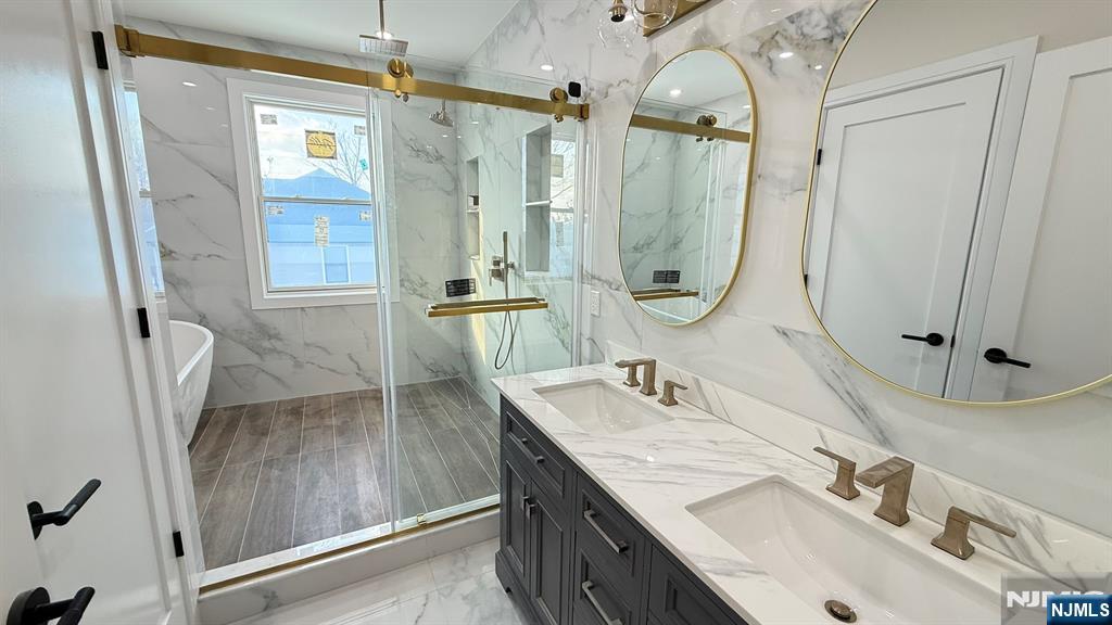 24 Peterson Road Wayne, NJ 07470 - Photo 21 of 31 a bathroom with double vanity sink and a mirror