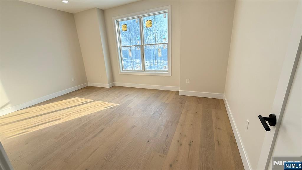 24 Peterson Road Wayne, NJ 07470 - Photo 24 of 31 wooden floor in an empty room with a window