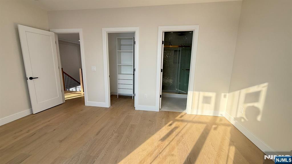 24 Peterson Road Wayne, NJ 07470 - Photo 25 of 31 an empty room with wooden floor and closet