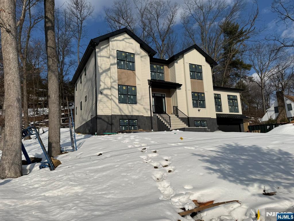 24 Peterson Road Wayne, NJ 07470 - Photo 31 of 31 a front view of a house with a yard