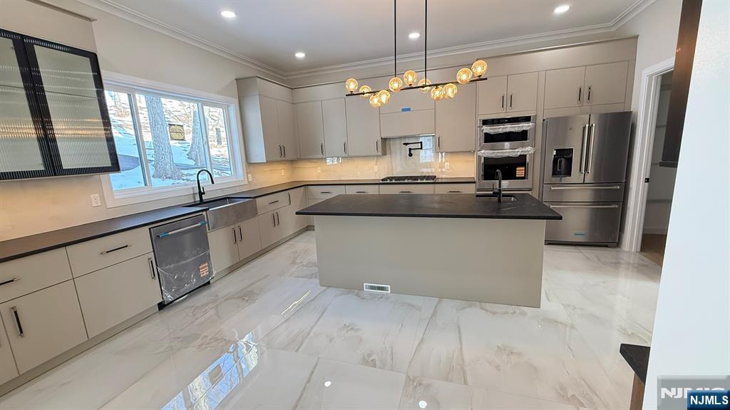24 Peterson Road Wayne, NJ 07470 - Photo 9 of 31 a large kitchen with a large counter top appliances and cabinets