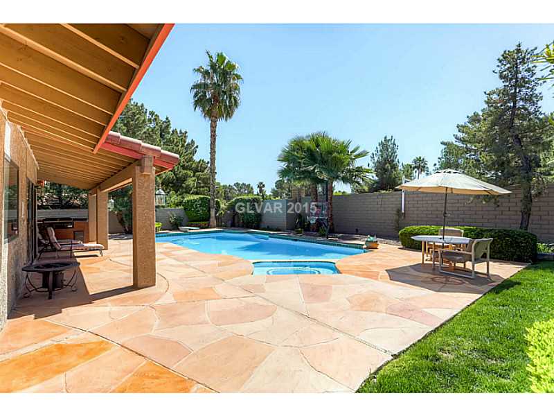 5 Quail Run Road Henderson, NV 89014 - Photo 29 of 35 Exterior Back. HUGE BACKYARD, with Plenty of Grass, POOL is HUGE - now this one built for doing LAPS. SPA and DIVING BOARD. POOL IS 10FT Deep.
