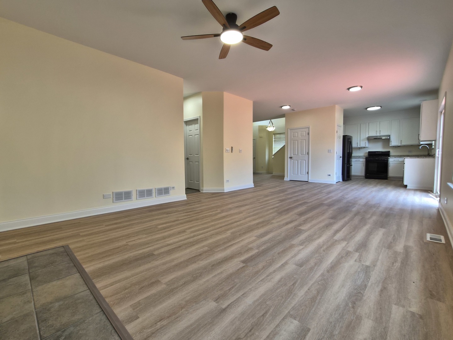 2355 Shiloh Drive Aurora, IL 60503 - Photo 12 of 40 wooden floor in an empty room with a window