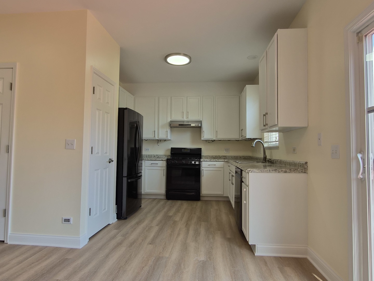 2355 Shiloh Drive Aurora, IL 60503 - Photo 14 of 40 a kitchen with a refrigerator stove and sink
