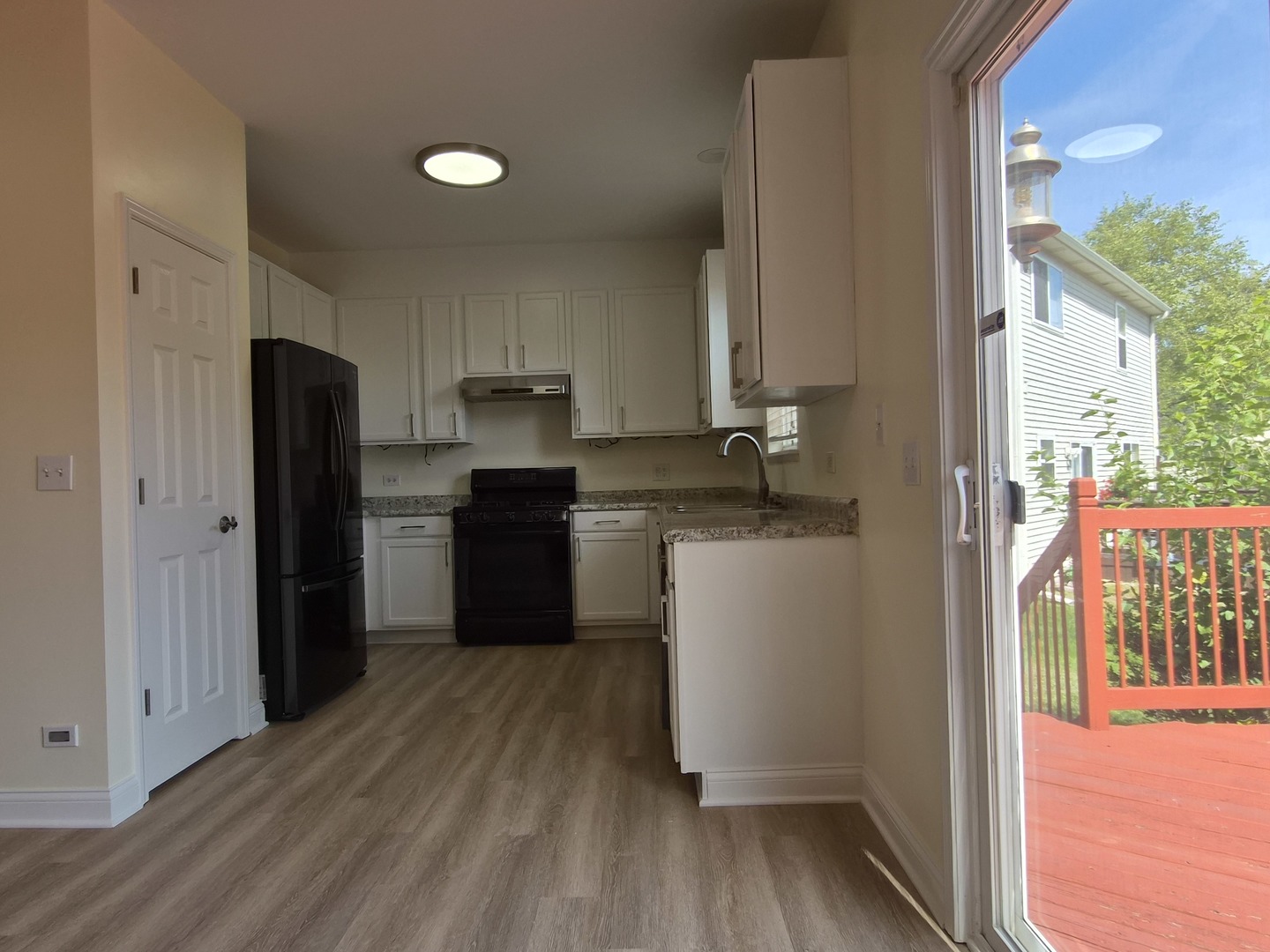 2355 Shiloh Drive Aurora, IL 60503 - Photo 15 of 40 a kitchen with a refrigerator and a stove top oven