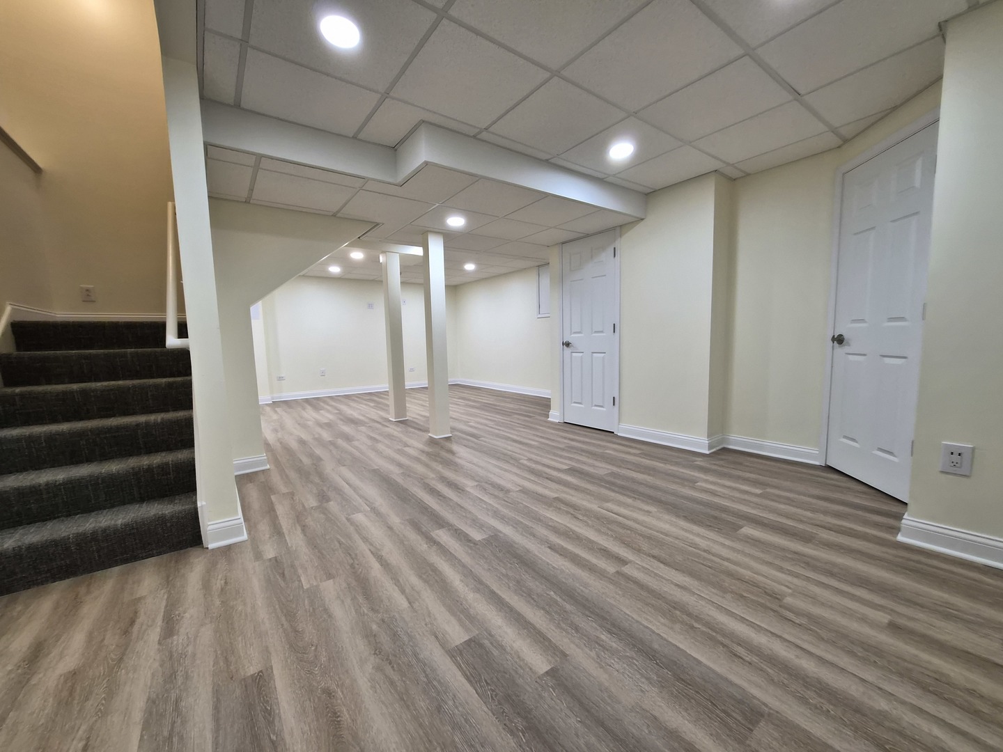 2355 Shiloh Drive Aurora, IL 60503 - Photo 31 of 40 a view of a room with stairs and a wooden floor