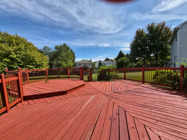 a view of a backyard with sitting area