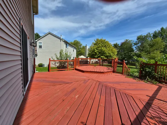 a balcony view with a seating space