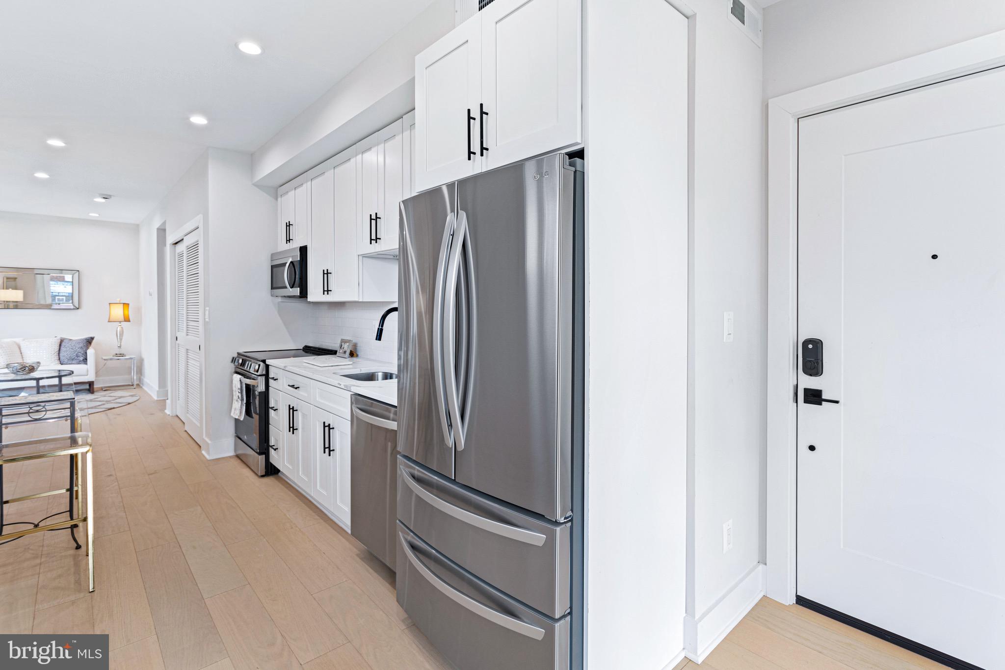 1910 Benning Road Northeast, Unit 2 Washington, DC 20002 - Photo 7 of 30 Wide Plank Harwood Flooring Throughout