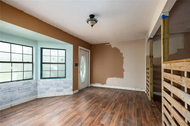 a view of an empty room with a window