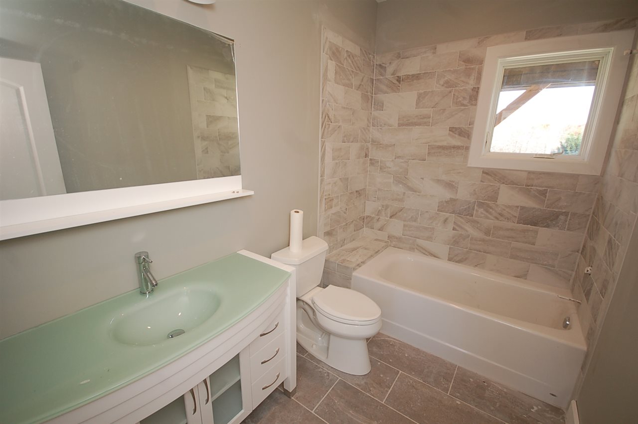 2505 Dunnes Shop Road Ruckersville, VA 22968 - Photo 18 of 29 a bathroom with a sink a toilet and bathtub