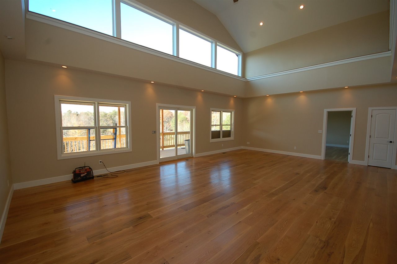 2505 Dunnes Shop Road Ruckersville, VA 22968 - Photo 21 of 29 a view of empty room with wooden floor and fan