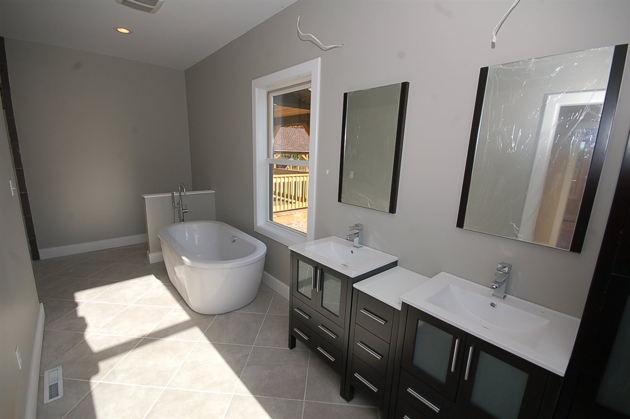2505 Dunnes Shop Road Ruckersville, VA 22968 - Photo 23 of 29 a spacious bathroom with a double vanity sink and a mirror