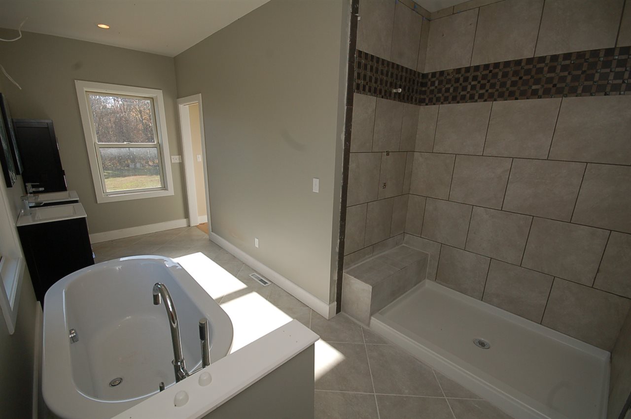 2505 Dunnes Shop Road Ruckersville, VA 22968 - Photo 24 of 29 a bathroom with a tub and a shower