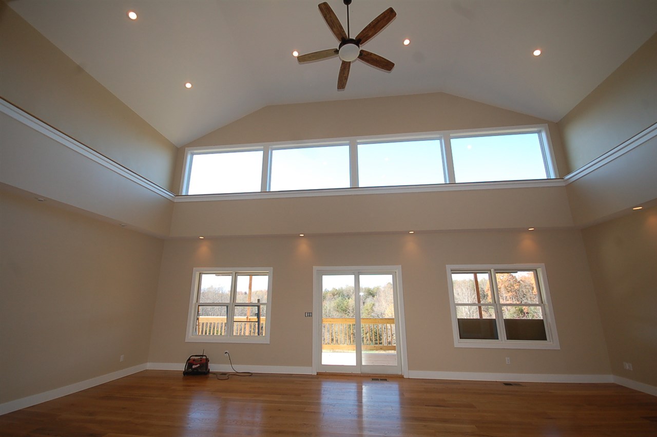 2505 Dunnes Shop Road Ruckersville, VA 22968 - Photo 3 of 29 a view of an empty room with wooden floor and a window