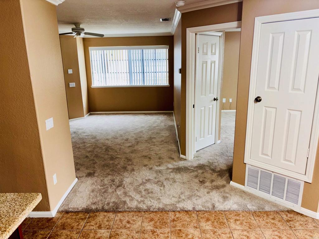 3545 Paseo De Francisco, Unit 225 Oceanside, CA 92056 - Photo 12 of 34 wooden floor with window in an empty room