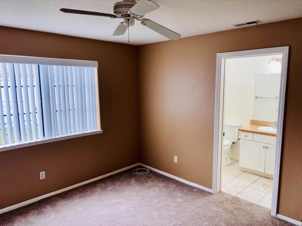 3545 Paseo De Francisco, Unit 225 Oceanside, CA 92056 - Photo 15 of 34 an empty room with a fan and a view of bathroom