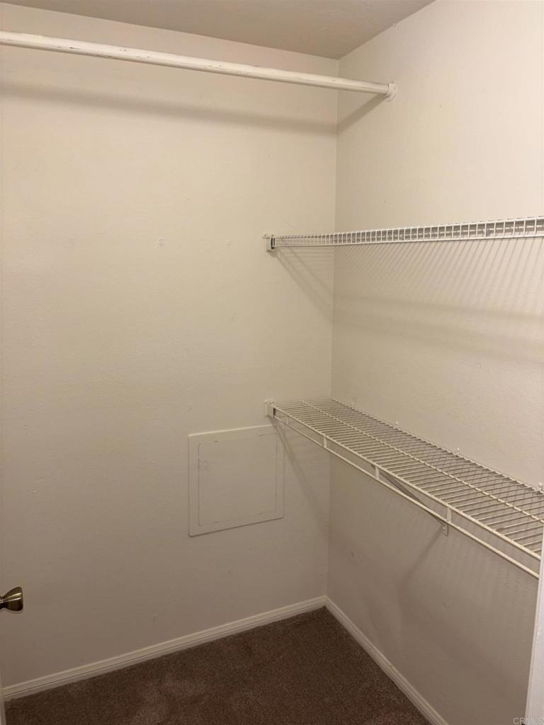 3545 Paseo De Francisco, Unit 225 Oceanside, CA 92056 - Photo 16 of 34 a view of a room with racks on the wall