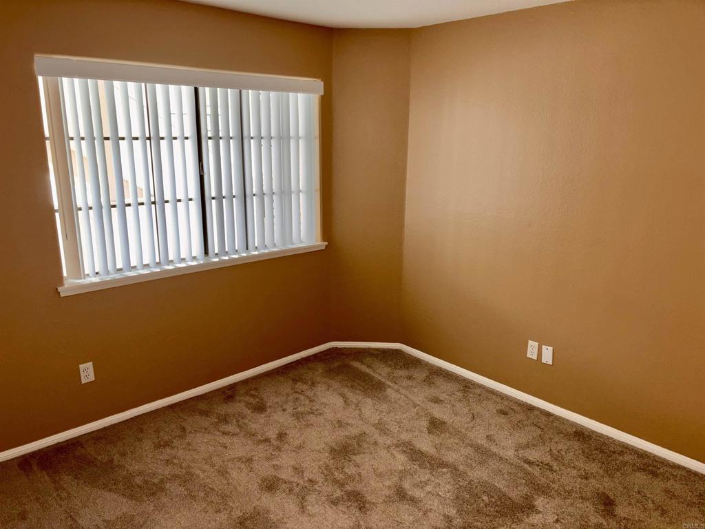 3545 Paseo De Francisco, Unit 225 Oceanside, CA 92056 - Photo 17 of 34 a view of a small space with wooden floor and a window
