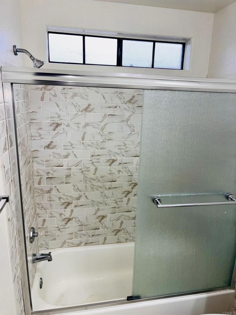 3545 Paseo De Francisco, Unit 225 Oceanside, CA 92056 - Photo 18 of 34 a bathroom with a bathtub and shower
