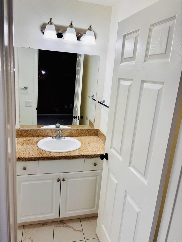3545 Paseo De Francisco, Unit 225 Oceanside, CA 92056 - Photo 19 of 34 a bathroom with a sink and a mirror