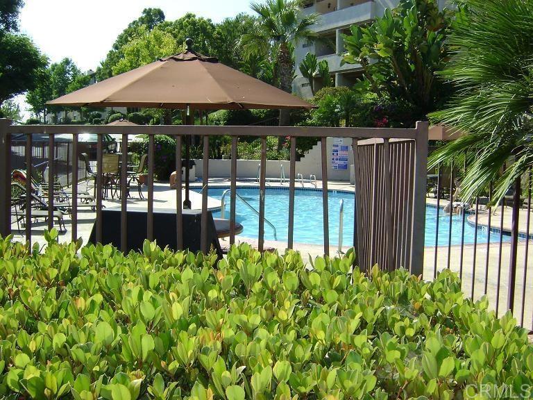 3545 Paseo De Francisco, Unit 225 Oceanside, CA 92056 - Photo 2 of 34 a view of a backyard with a garden