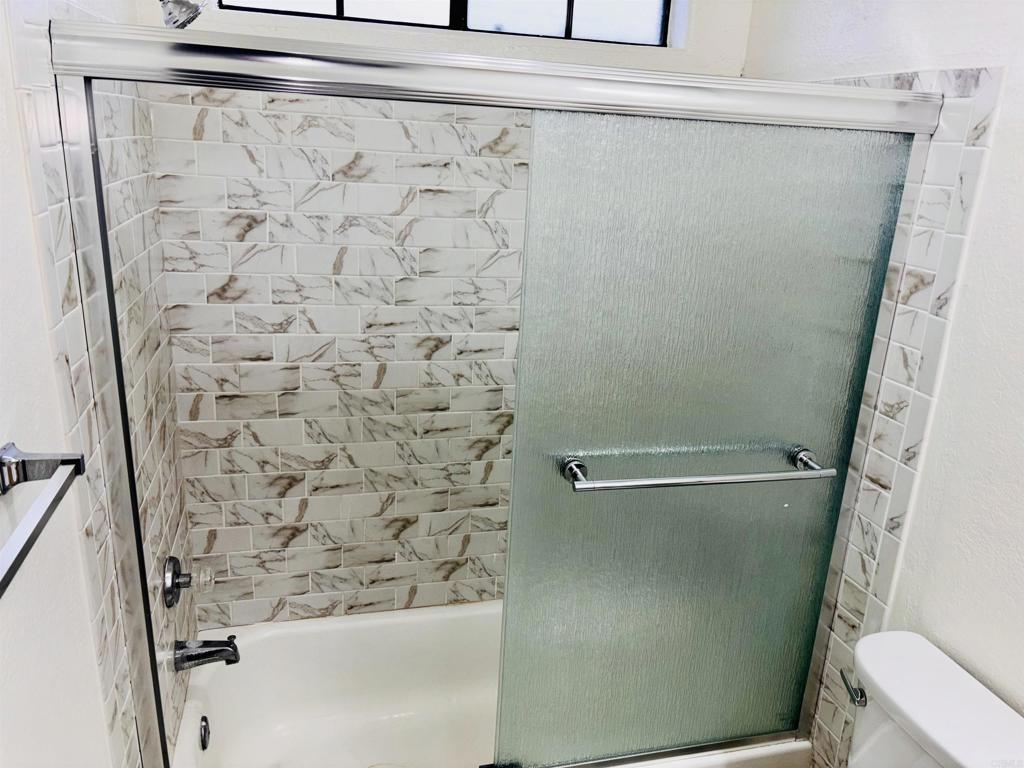 3545 Paseo De Francisco, Unit 225 Oceanside, CA 92056 - Photo 21 of 34 a bathroom with a shower and a toilet