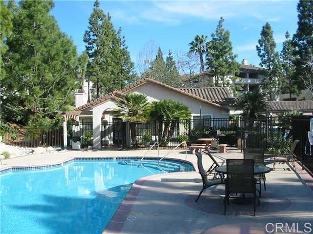 3545 Paseo De Francisco, Unit 225 Oceanside, CA 92056 - Photo 4 of 34 a view of a swimming pool with outdoor seating