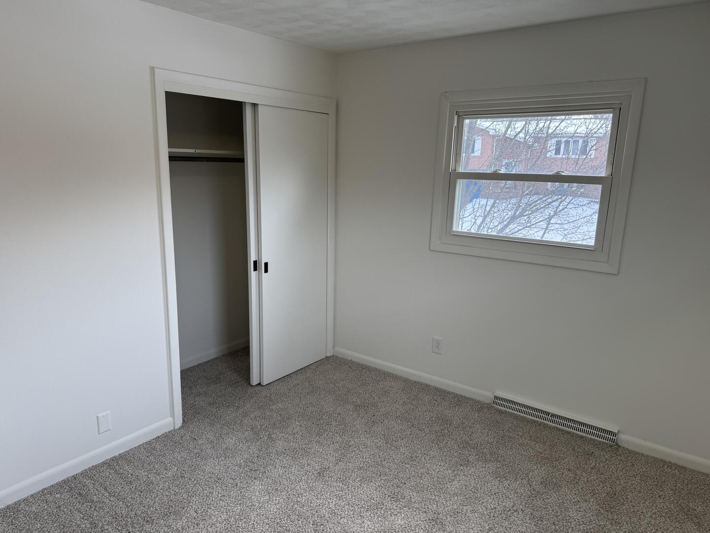 2452 Florian Court Decatur, IL 62526 - Photo 12 of 28 an empty room with windows and entrance