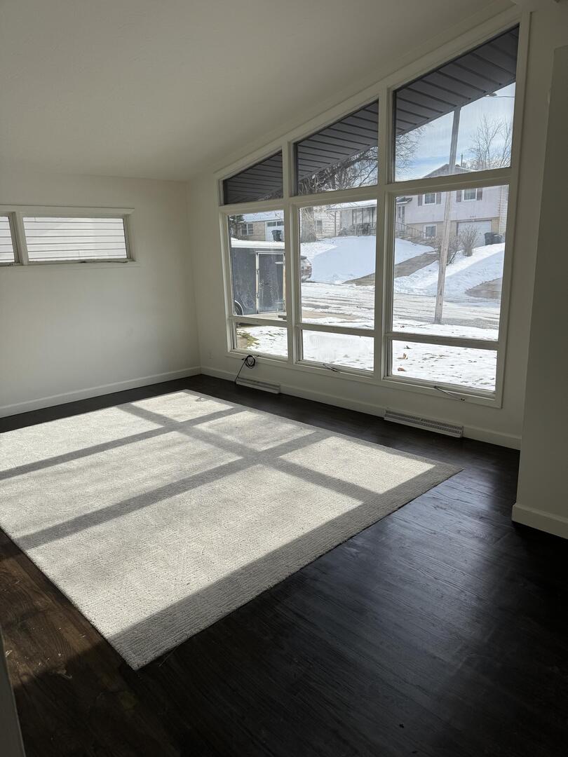 2452 Florian Court Decatur, IL 62526 - Photo 3 of 28 a view of an empty room with wooden floor and a window