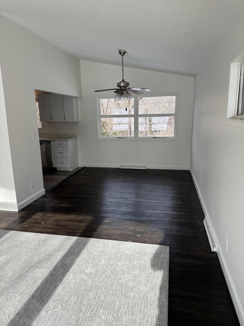 2452 Florian Court Decatur, IL 62526 - Photo 5 of 28 a view of a hallway with wooden floor and a chandelier