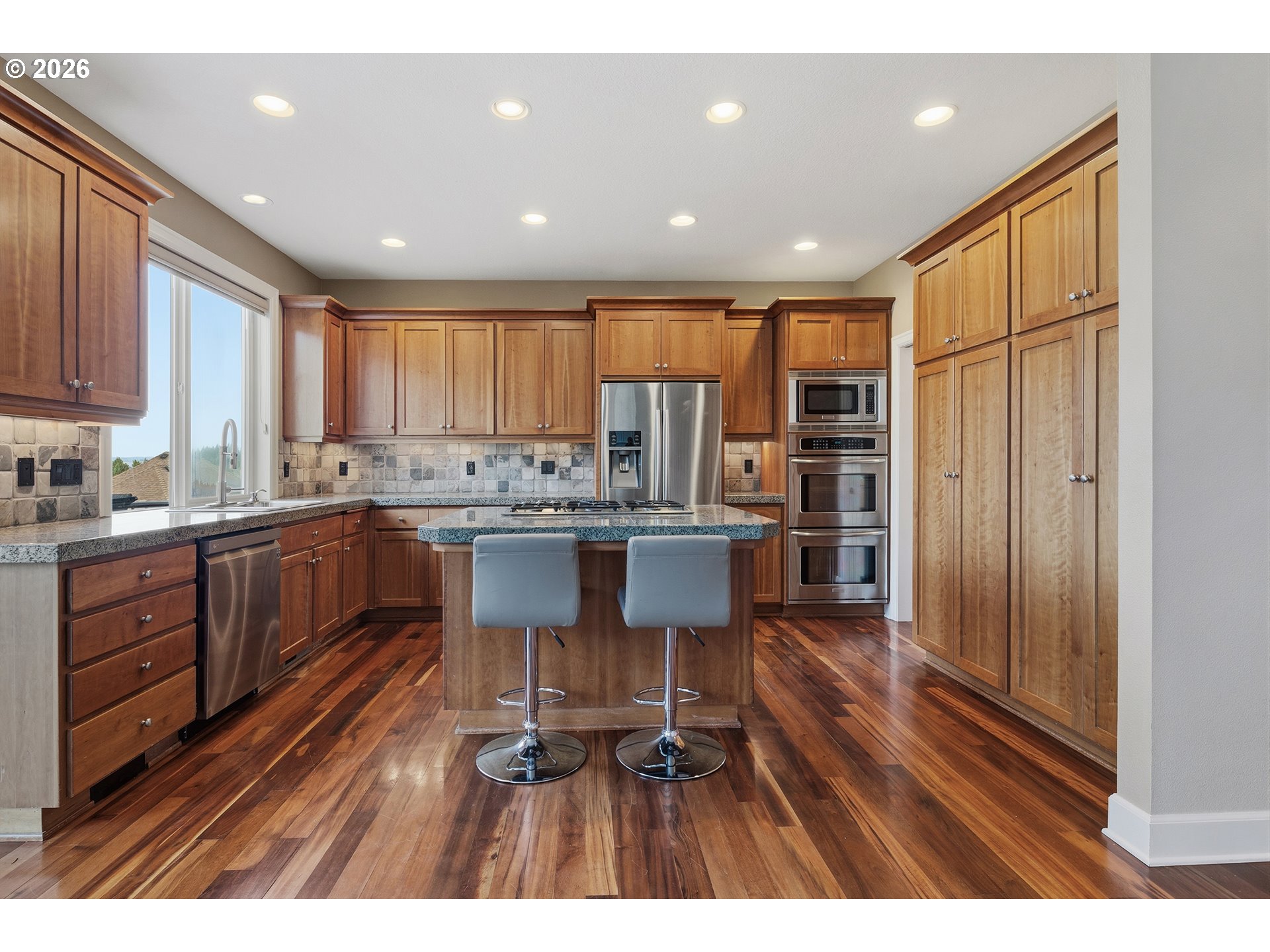 3525 Northwest Sunset View Terrace Portland, OR 97229 - Photo 12 of 48 a kitchen with a sink appliances cabinets and furniture