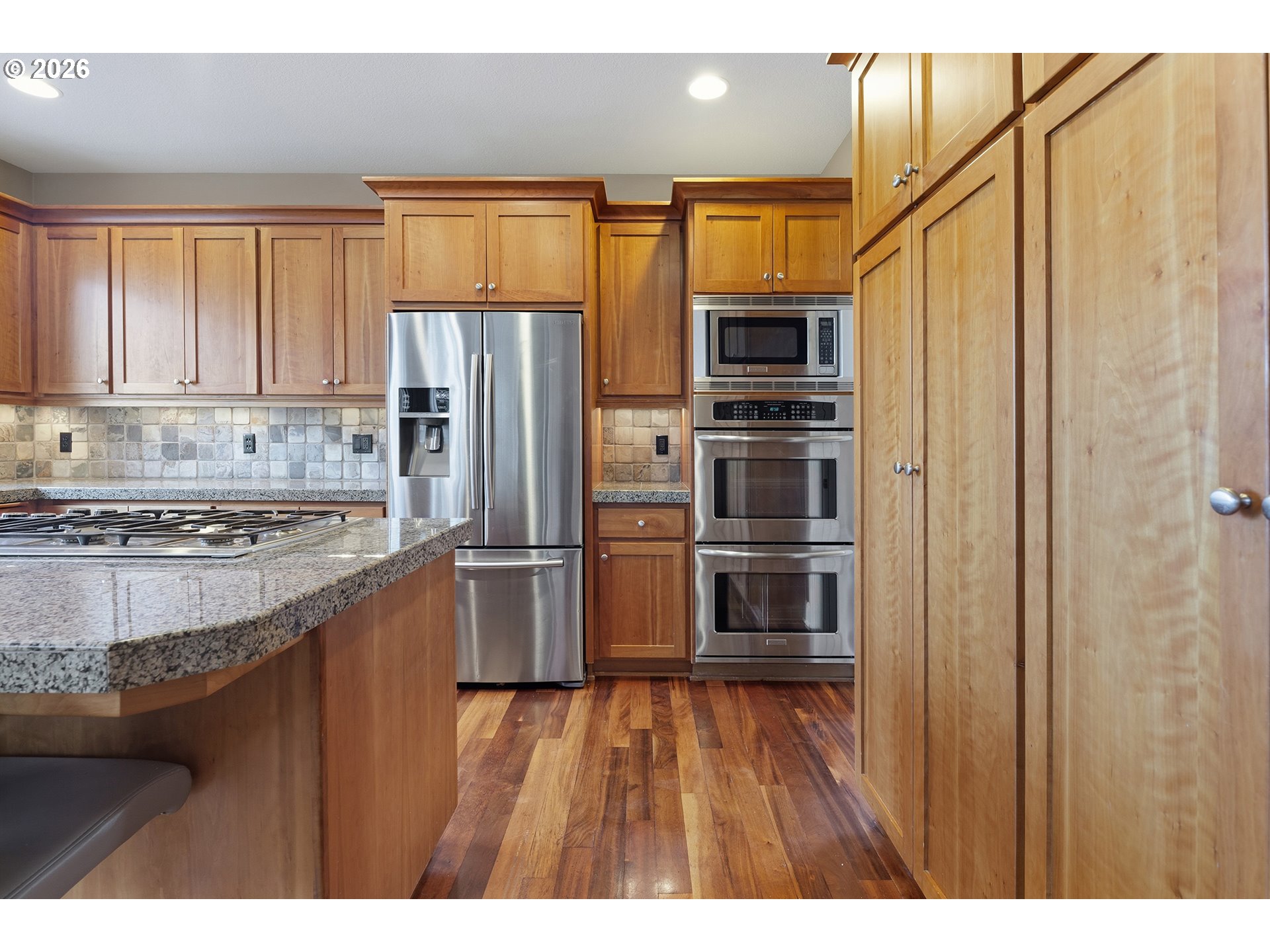3525 Northwest Sunset View Terrace Portland, OR 97229 - Photo 13 of 48 a kitchen with stainless steel appliances granite countertop a refrigerator and a sink