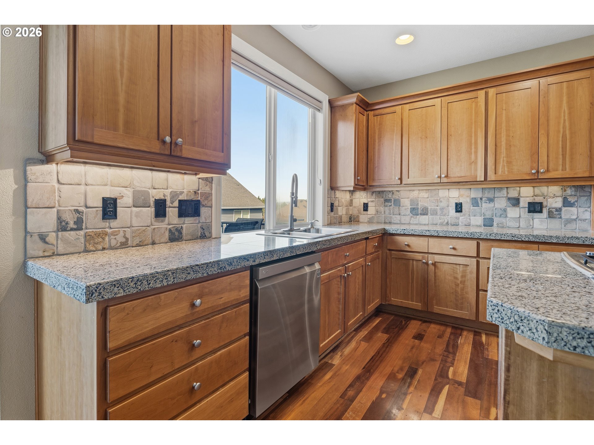3525 Northwest Sunset View Terrace Portland, OR 97229 - Photo 14 of 48 a kitchen with a sink stove and cabinets