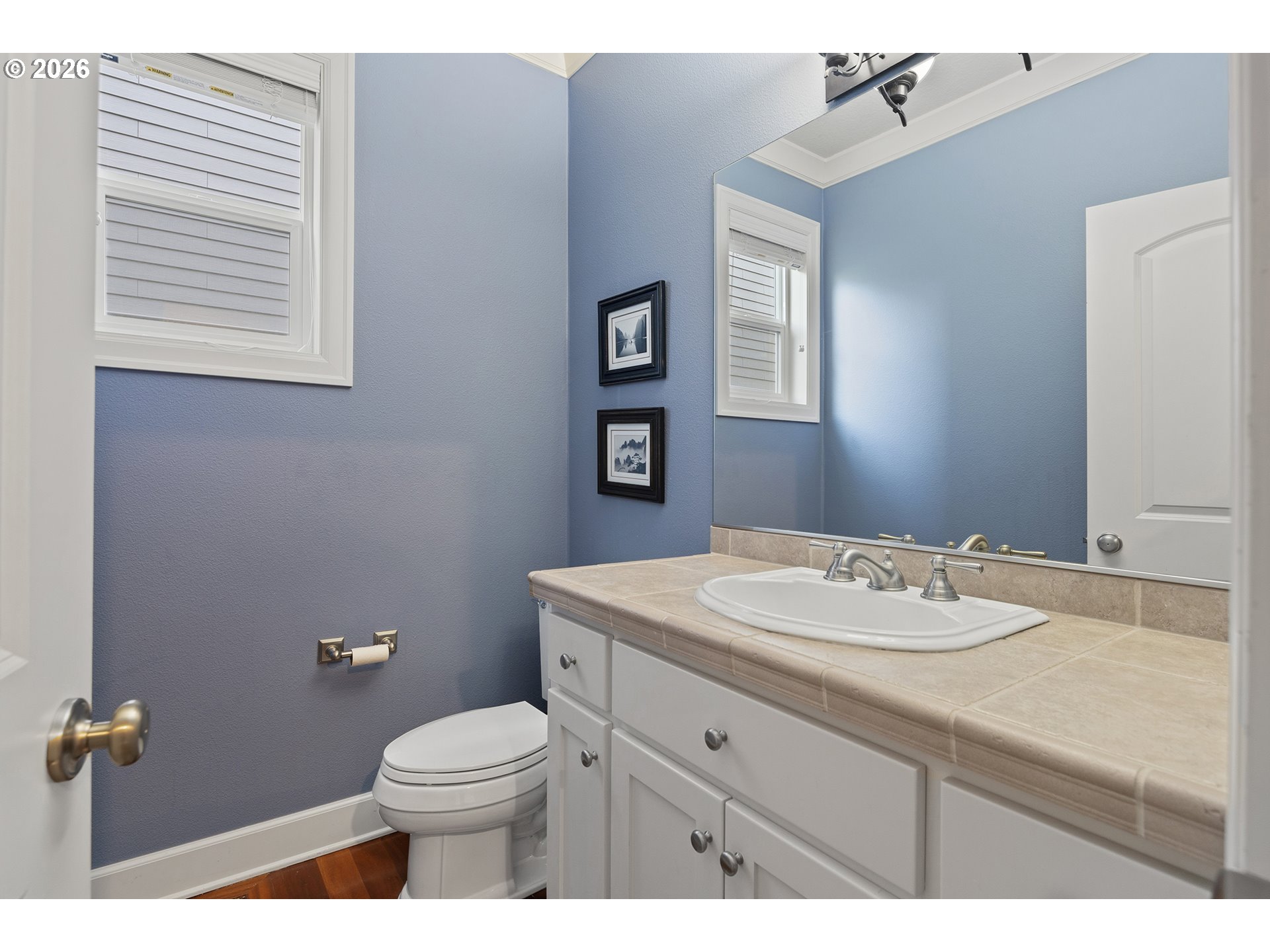 3525 Northwest Sunset View Terrace Portland, OR 97229 - Photo 18 of 48 a bathroom with a sink vanity mirror and toilet