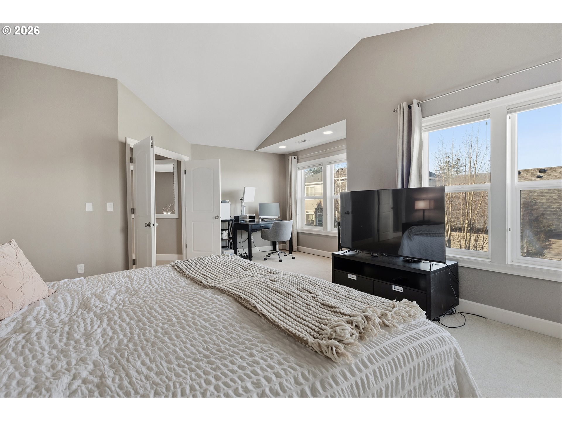 3525 Northwest Sunset View Terrace Portland, OR 97229 - Photo 21 of 48 a bedroom with a bed and a flat screen tv