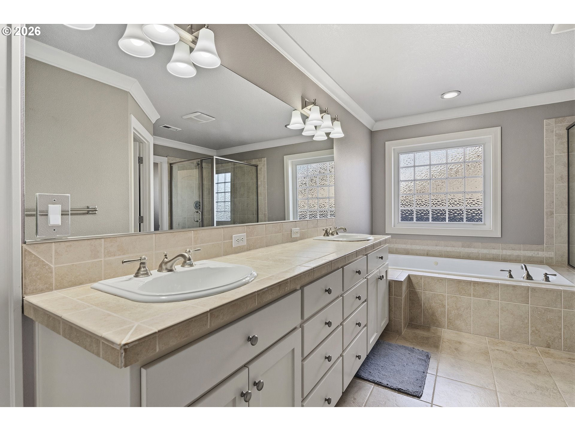 3525 Northwest Sunset View Terrace Portland, OR 97229 - Photo 22 of 48 a bathroom with a sink double vanity mirror and a bathtub