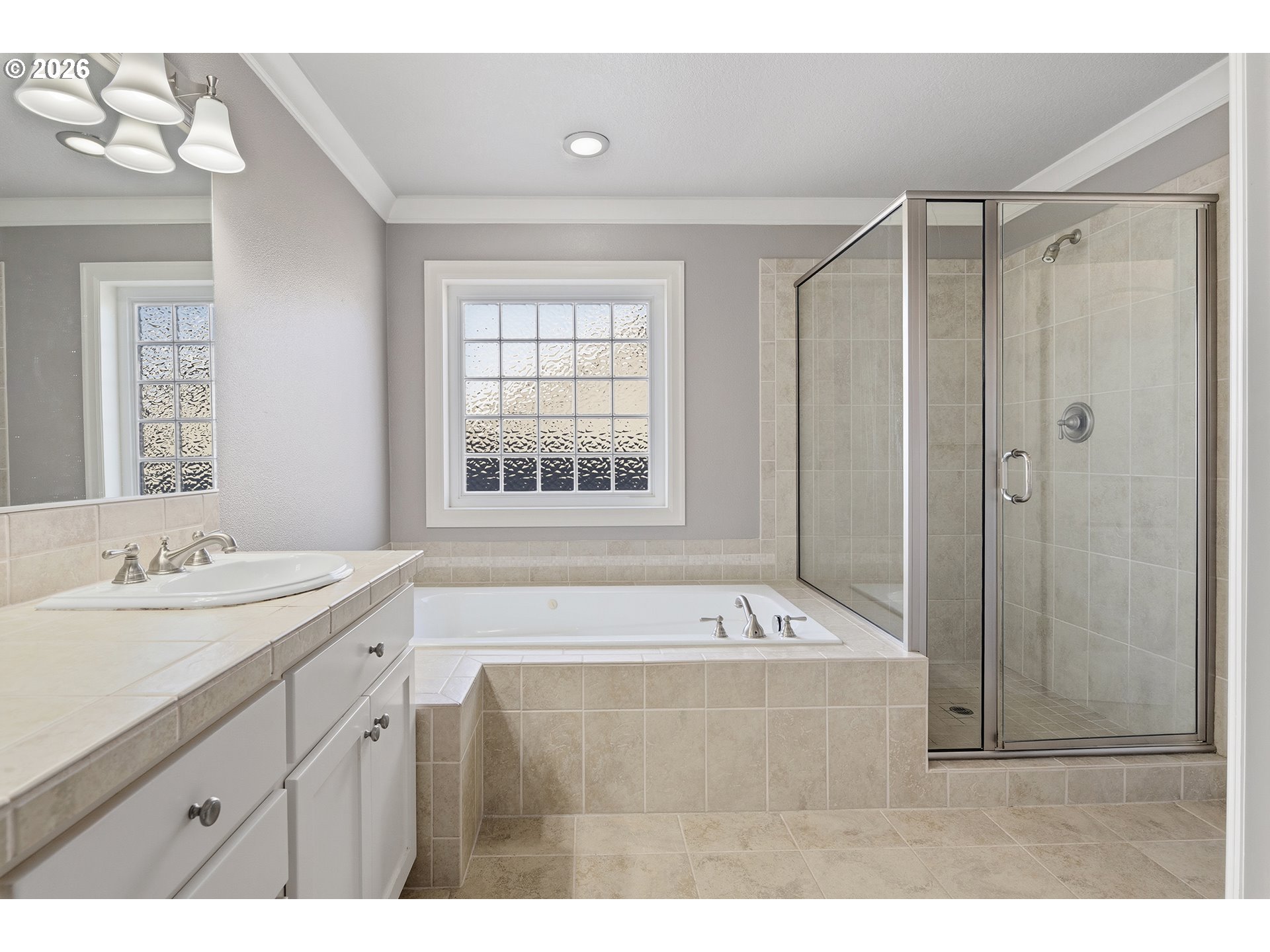 3525 Northwest Sunset View Terrace Portland, OR 97229 - Photo 23 of 48 a bathroom with a tub a sink and a mirror