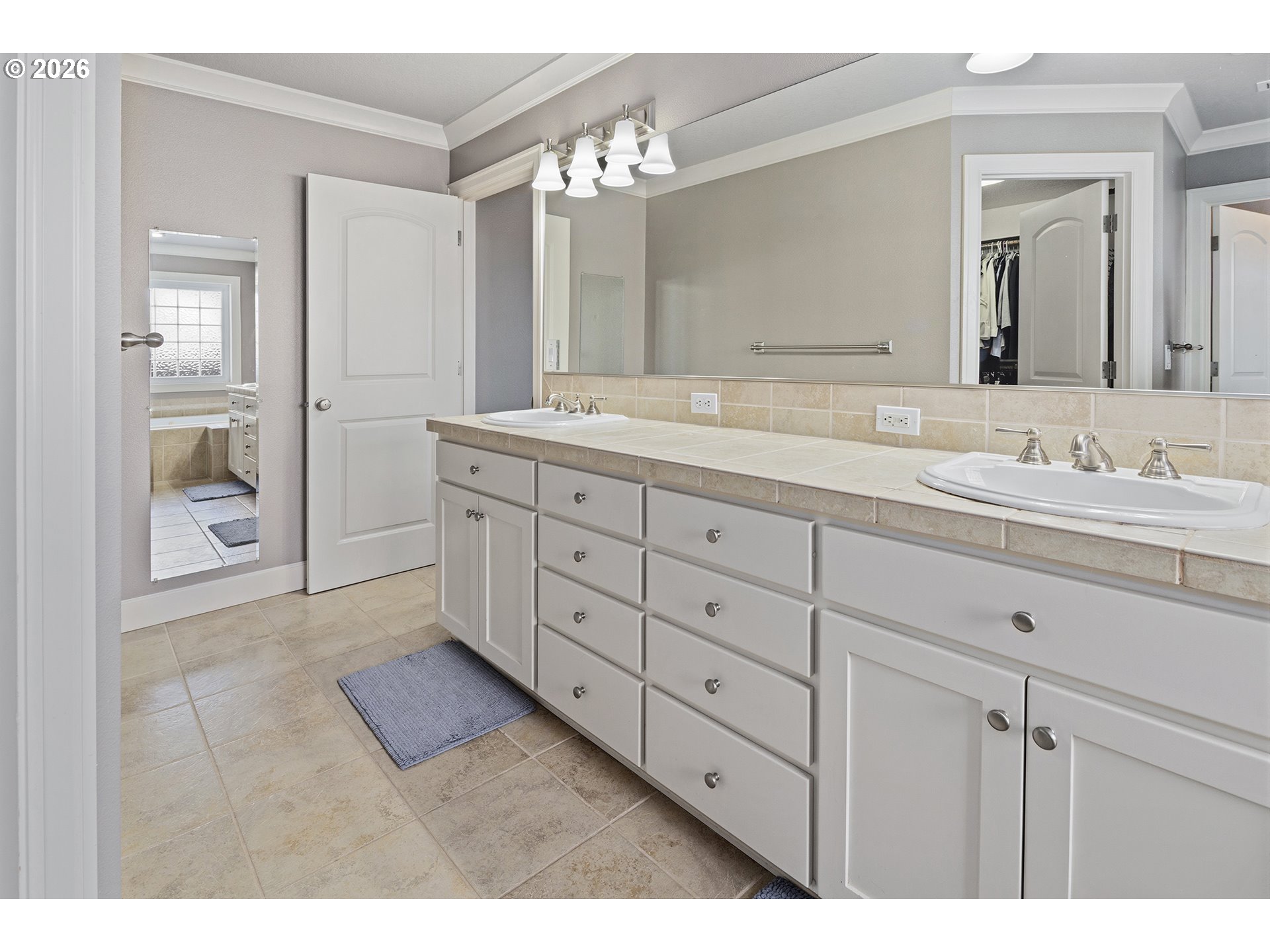 3525 Northwest Sunset View Terrace Portland, OR 97229 - Photo 24 of 48 a spacious bathroom with double sink and a mirror