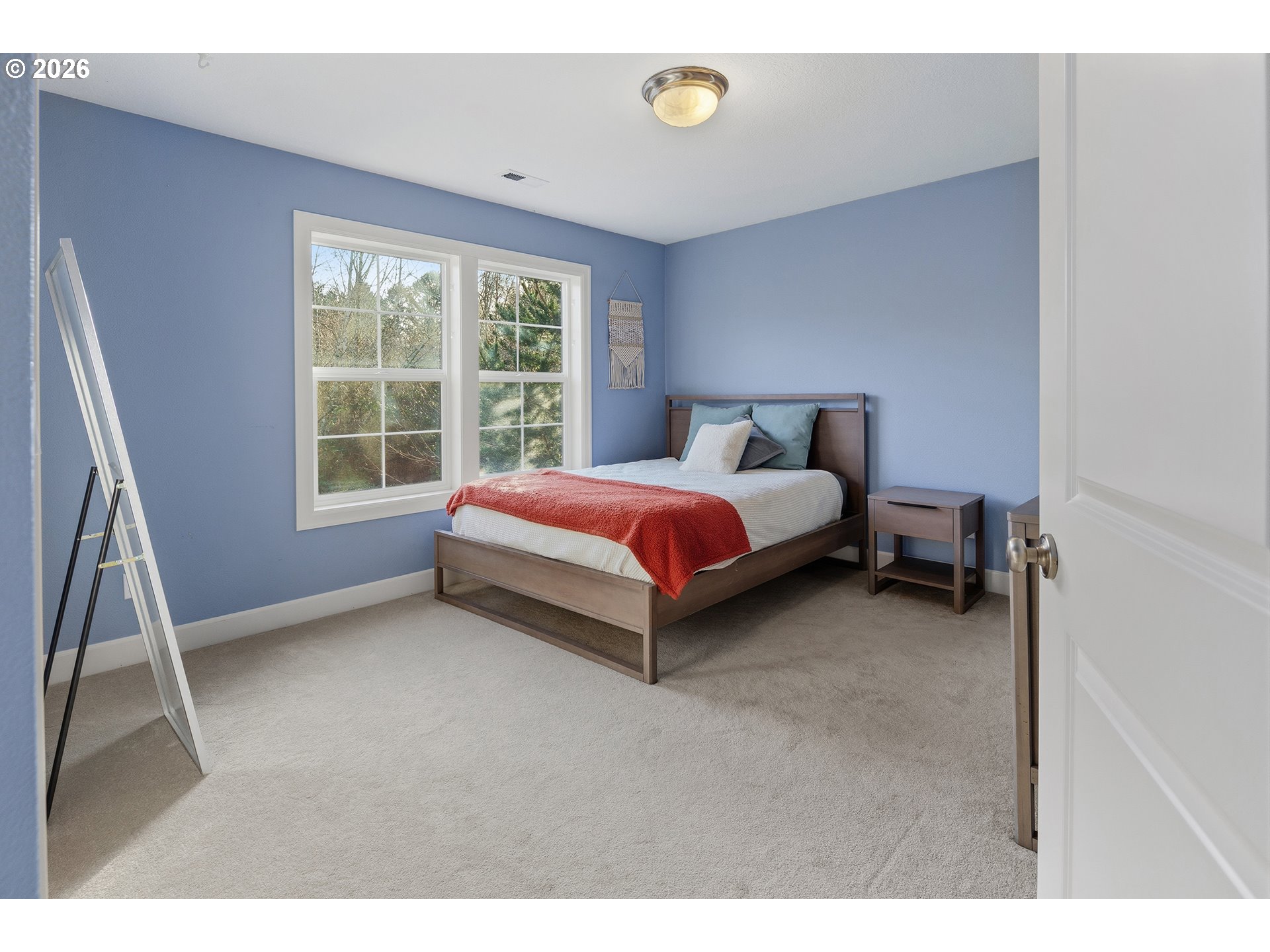 3525 Northwest Sunset View Terrace Portland, OR 97229 - Photo 27 of 48 a bed room with a bed and a window