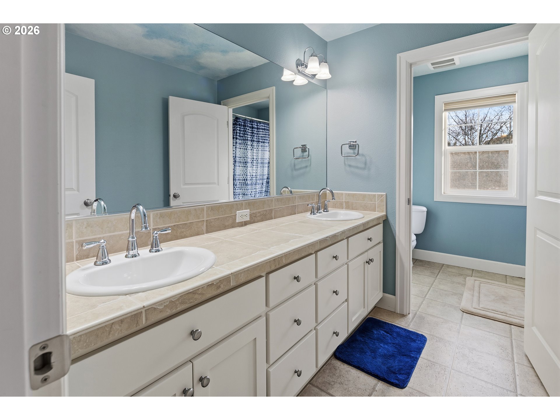 3525 Northwest Sunset View Terrace Portland, OR 97229 - Photo 29 of 48 a spacious bathroom with double sink a large mirror a vanity and a shower