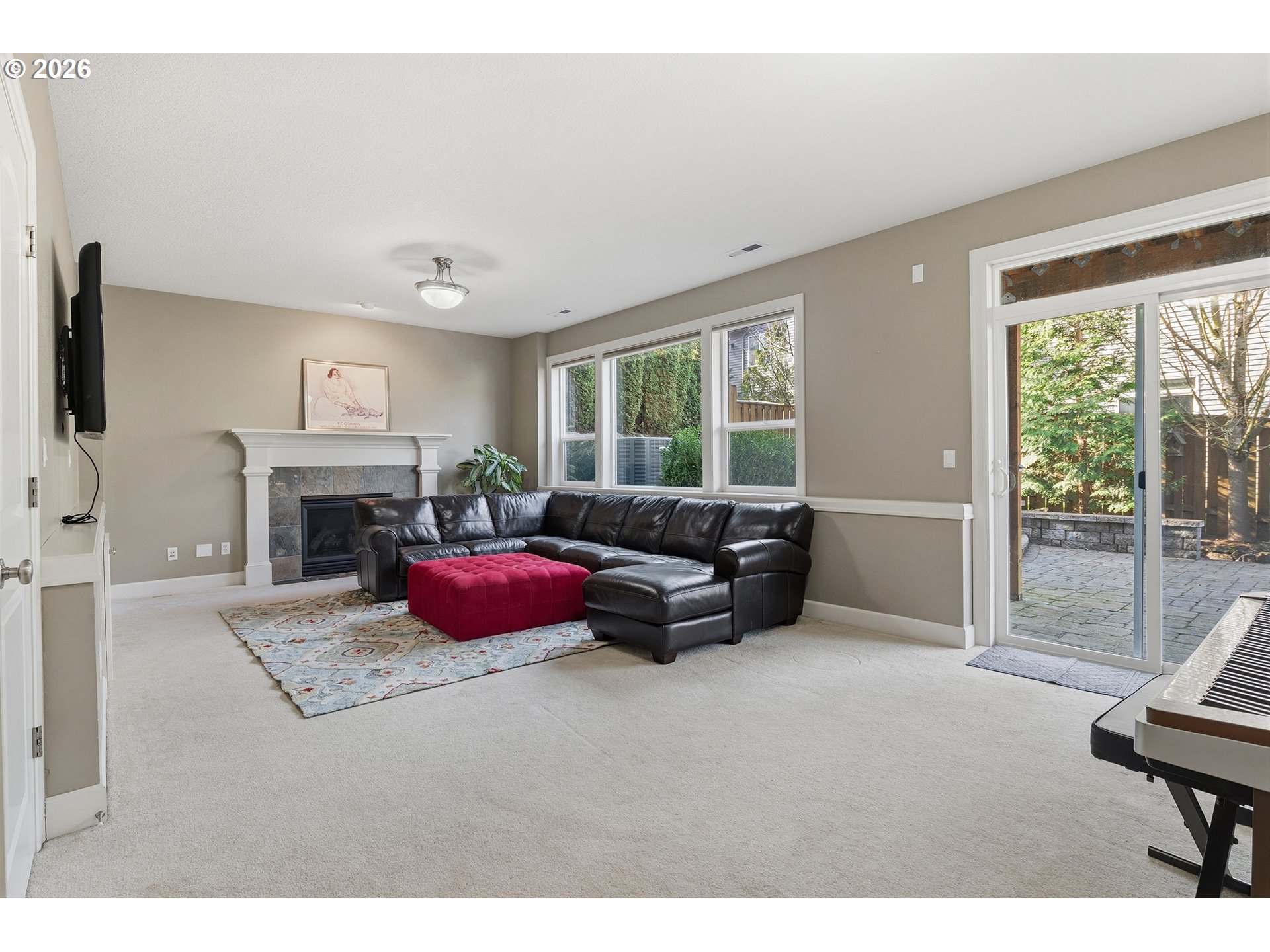 3525 Northwest Sunset View Terrace Portland, OR 97229 - Photo 34 of 48 a living room with furniture large window and a flat screen tv