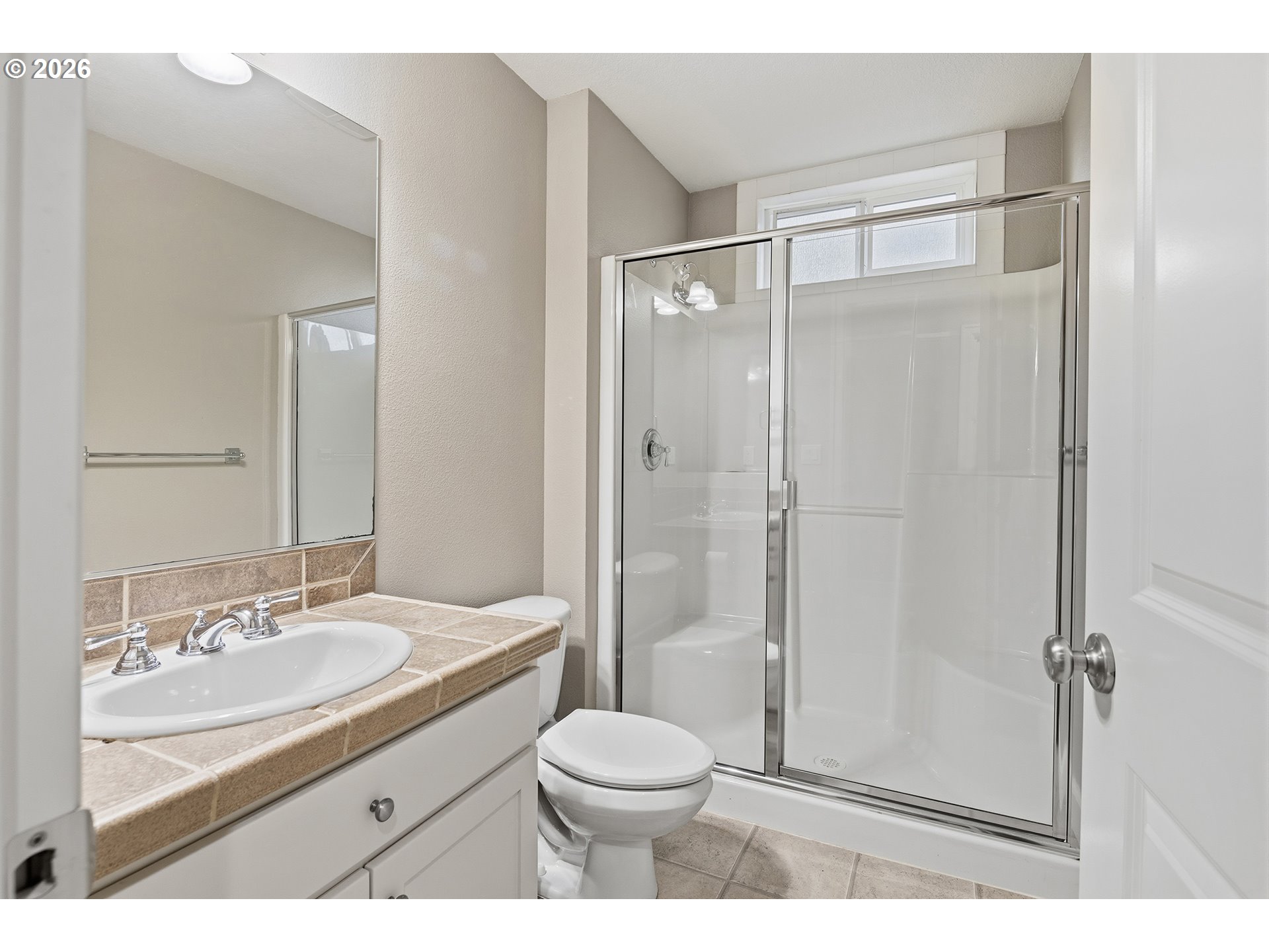 3525 Northwest Sunset View Terrace Portland, OR 97229 - Photo 37 of 48 a bathroom with a sink toilet vanity and shower