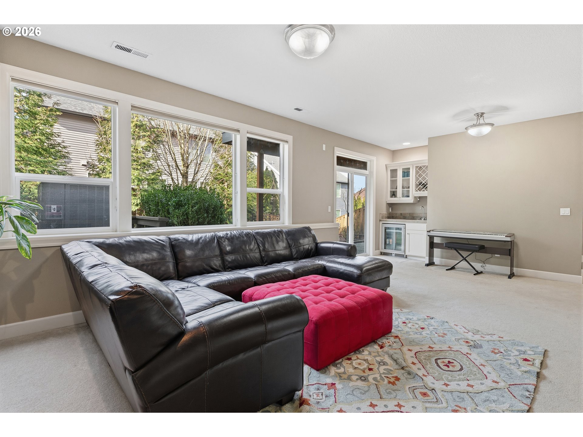 3525 Northwest Sunset View Terrace Portland, OR 97229 - Photo 39 of 48 a living room with furniture and large windows