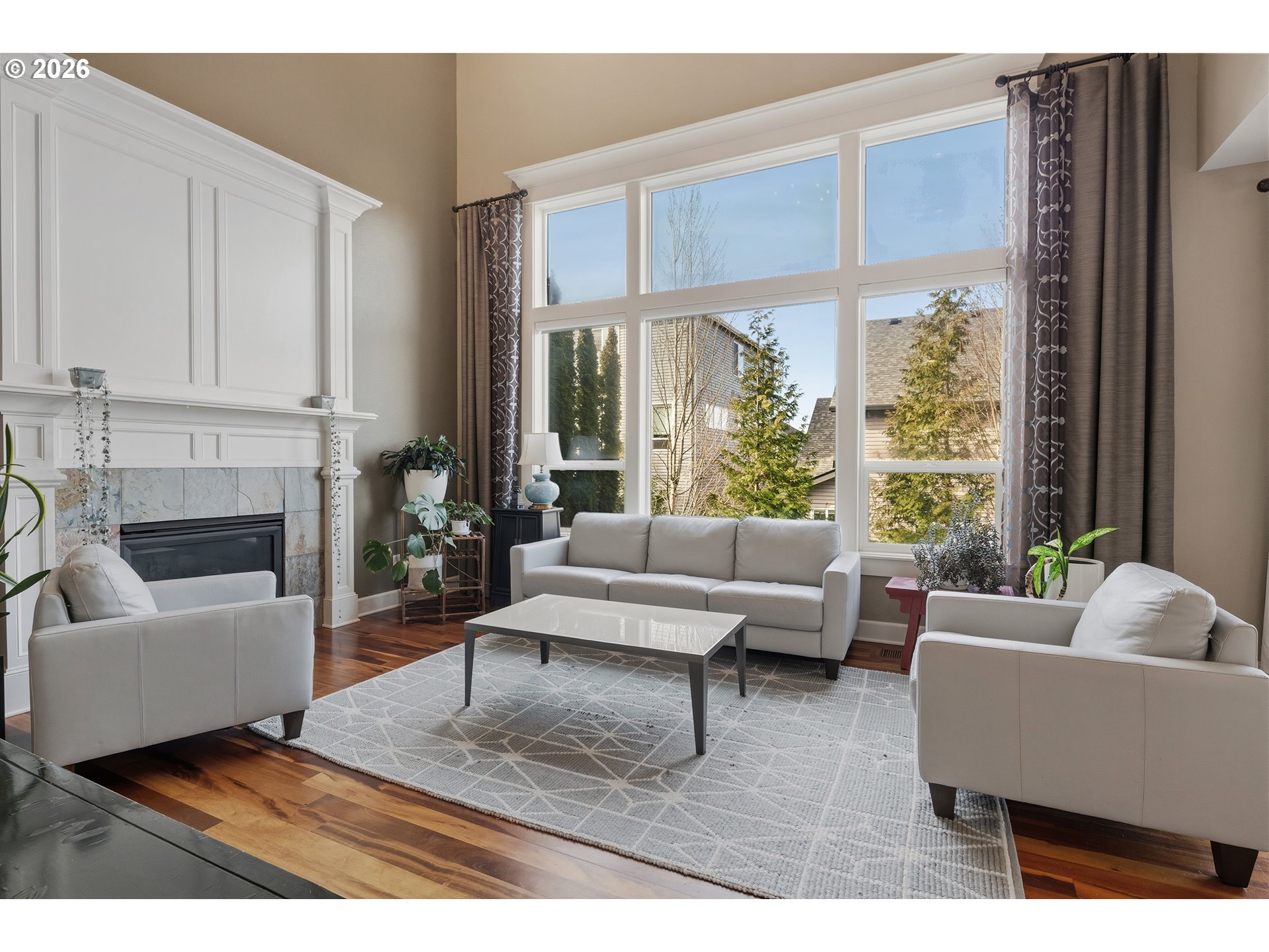 3525 Northwest Sunset View Terrace Portland, OR 97229 - Photo 6 of 48 a living room with furniture and a large window