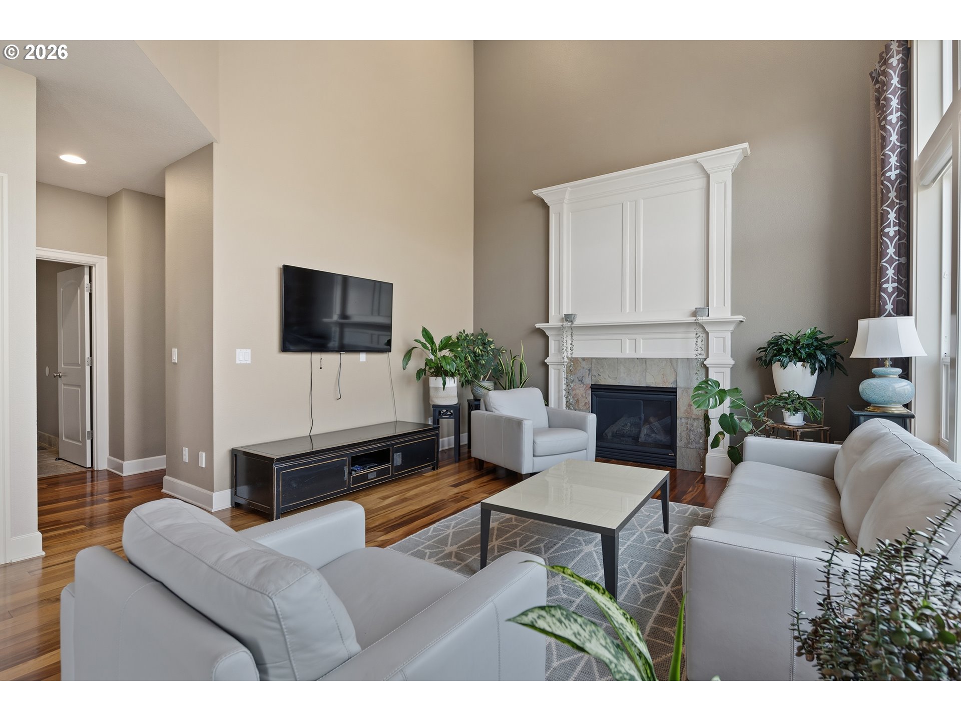 3525 Northwest Sunset View Terrace Portland, OR 97229 - Photo 7 of 48 a living room with furniture a fireplace and a flat screen tv