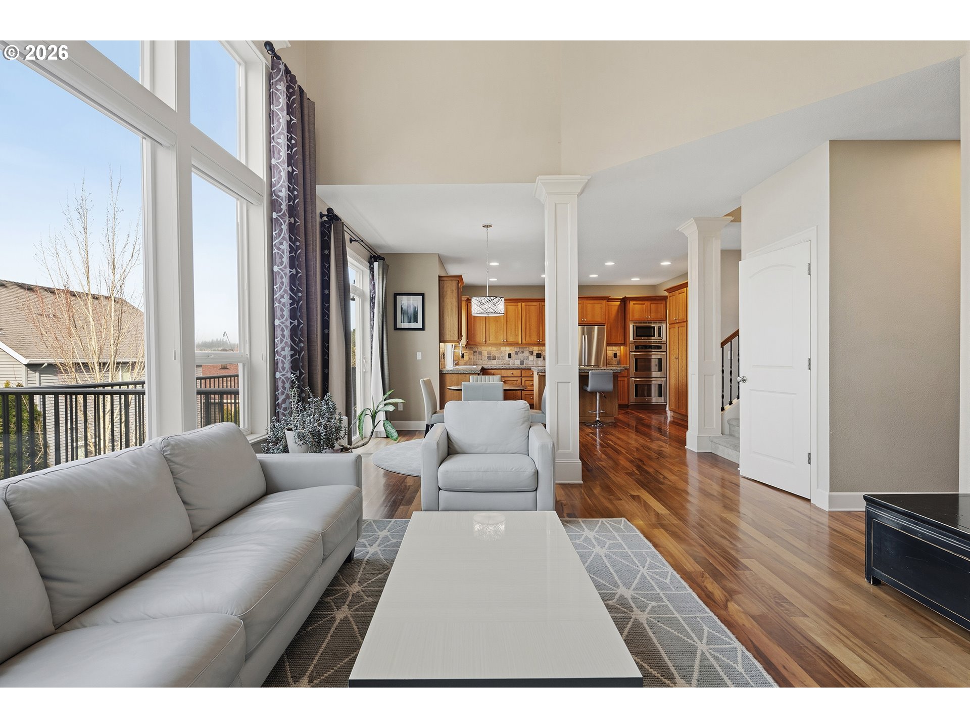 3525 Northwest Sunset View Terrace Portland, OR 97229 - Photo 8 of 48 a living room with furniture large window and wooden floor