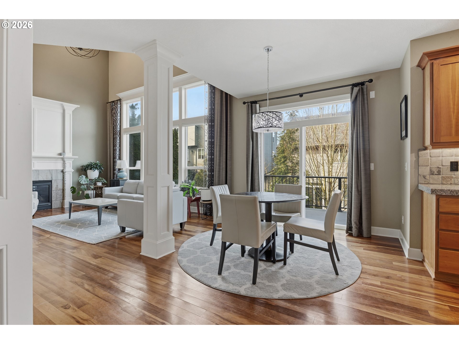 3525 Northwest Sunset View Terrace Portland, OR 97229 - Photo 9 of 48 a living room with furniture a large window and wooden floor